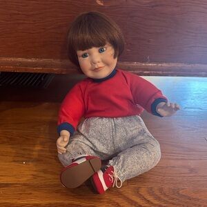 Red and Gray Porcelain Baby Doll